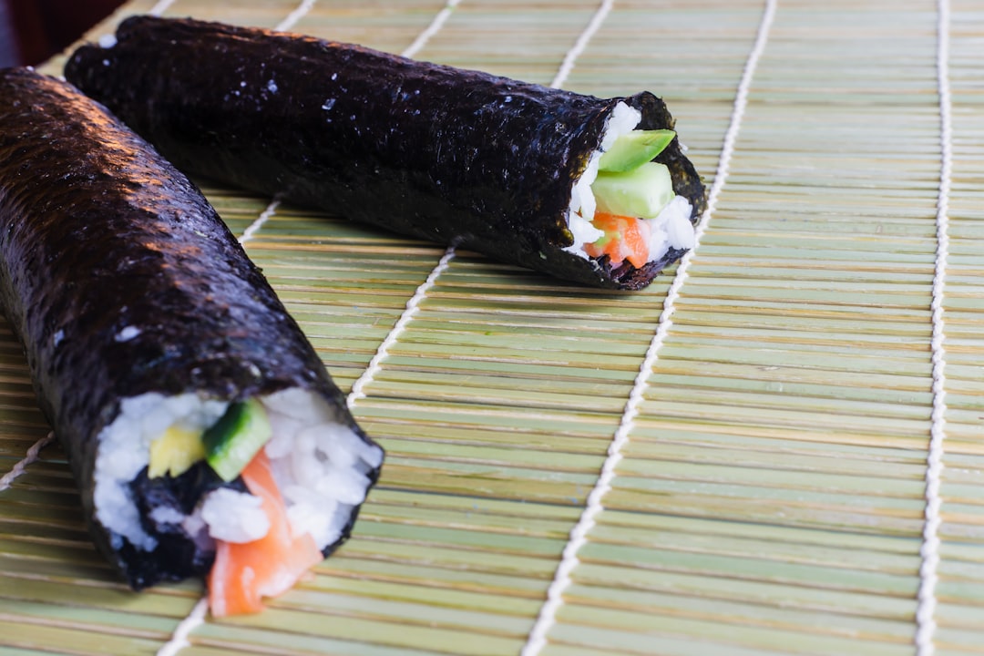 Sushi roll with spicy salmon and avocado ready to serve