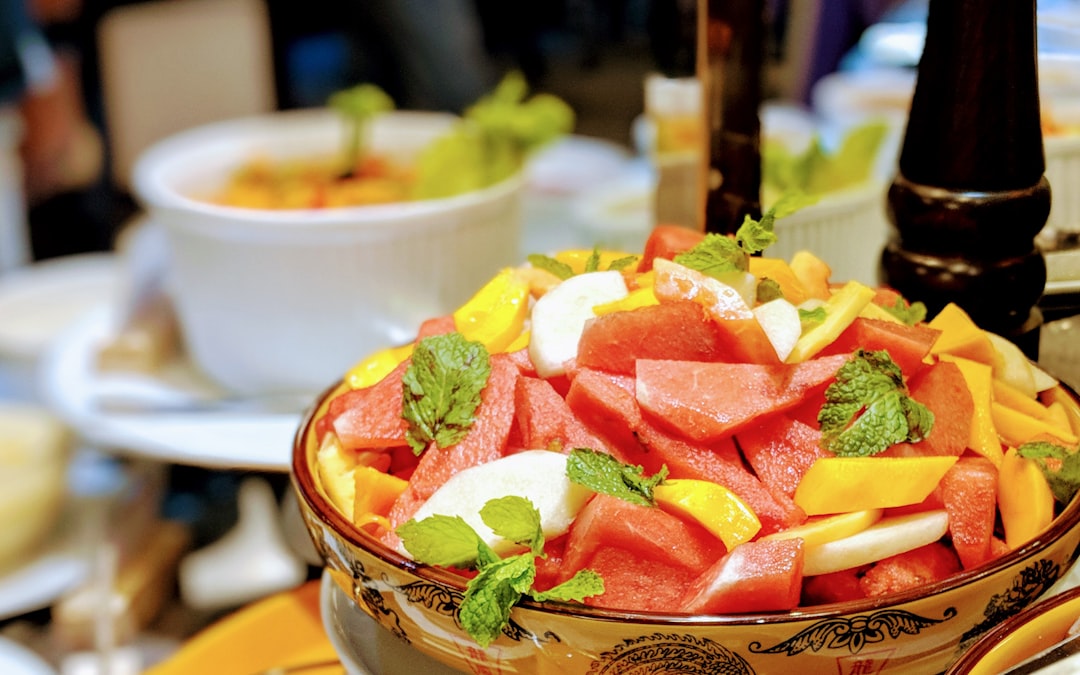 A bowl of colorful tropical fruit salad