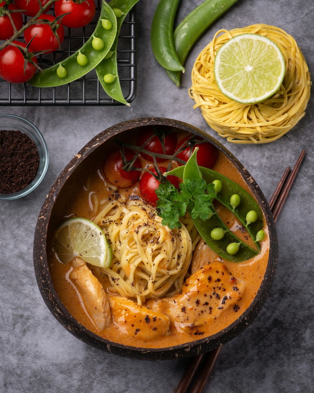 Fresh ingredients for homemade ramen, including salmon, noodles, and vegetables